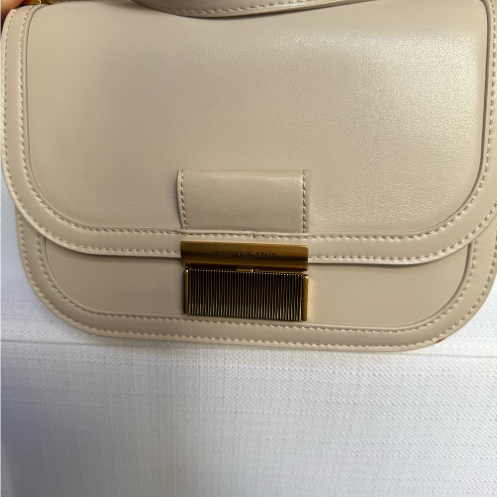 Charles & Keith cross body cream purse